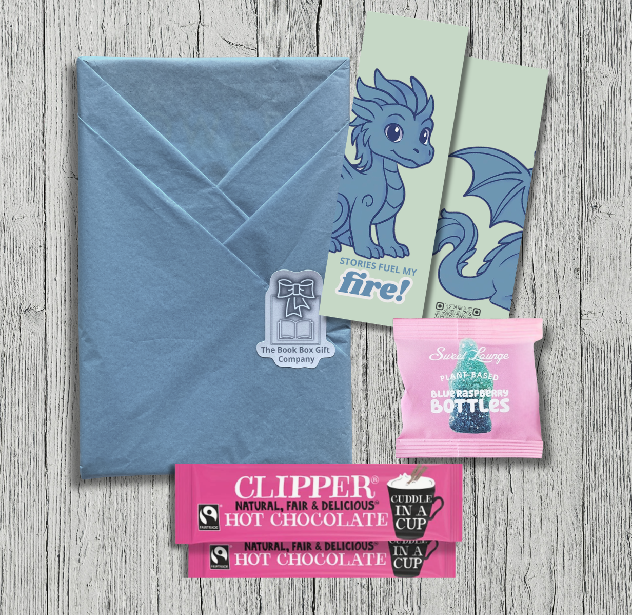 Surprise book one off gift wrapped book gift for children, tweens and teens with bookmarks and added sweet treats.